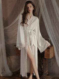 Summer Ice Silk Lace Robe
Main fabric: 95.3% polyester 4.7% spandex
Lace: 89.3% nylon 10.7% spandex




Robe Size/cm


Length


Bust


Sleeve


Shoulder


Fit weigh




M


131


103


46


38.5


40-55kg




L


132


107


47


39.5


55-60kg




XL


133


111


48


40.5


60-70kg







 	The above size is manually measured by “tiling-stretching”, there may be an error of 1-3cm!
 	The size is for reference only, please choose according to your size.
 	It is recommended to wash by hand in co Fitted V-neck Sleep Robe, Fitted V-neck Robe For Sleep, White Long-length Sleepwear For Loungewear, White V-neck Loungewear Robe, White Long Sleeve Satin Sleepwear, Long Sleeve White Satin Sleepwear, White Satin Long Sleeve Sleepwear, Fitted White V-neck Robe, Fitted Long Sleeve Robe For Loungewear