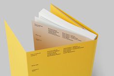 an open yellow folder with papers in it