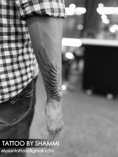 a man with a tattoo on his arm