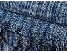 blue and white striped fabric with fringes on the bottom, in different sizes and colors