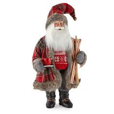 a santa clause figurine holding a cup and saucer in one hand, wearing a red plaid coat