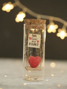 a message in a bottle that says you have my heart with a red heart inside