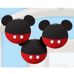 two mickey mouse paper lanterns hanging from the ceiling