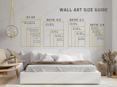 a white bed sitting in a bedroom next to a wall with art size guide on it