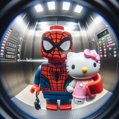 a hello kitty and spiderman character are seen through a round hole in an elevator