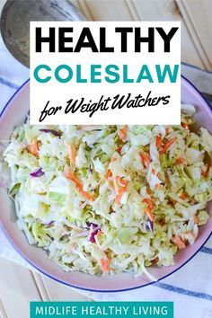 a white bowl filled with coleslaw on top of a table