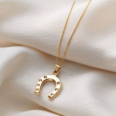 "This beautiful necklace is made from gorgeous 9ct yellow gold. This design features a lucky horseshoe charm suspended from a 9ct gold chain. The horseshoe is seen as symbol of good luck and protection which makes this gold necklace the perfect gift for the bride. Made from: 9ct Yellow Gold Dimensions: Pendant measures approx 15mm wide. 18\" chain. The necklace will be packaged in a luxe branded gift box (see product images)." Equestrian Necklace, Horseshoe Pendant, Gift For The Bride, Horseshoe Necklace, Equestrian Jewelry, Beautiful Gold Necklaces, Horse Necklace, Horse Jewelry, Lucky Horseshoe