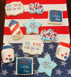 decorated cookies on a patriotic table cloth with red, white and blue decorations