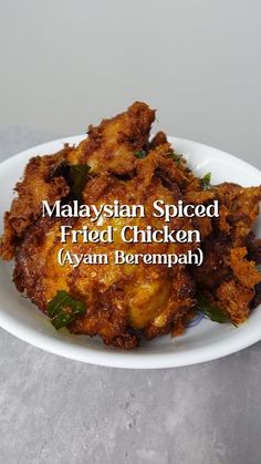 malaysian spiced fried chicken on a white plate