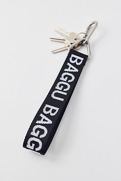 The essential BAGGU keychain in UO exclusive colors. Easy to find but hard to forget, this nylon webbing keychain features a BAGGU logo. Features BAGGU keychain Recycled webbing bag charm with a BAGGU logo Add it to your fave BAGGU bag Easy clip closure UO exclusive Content + Care 100% Recycled nylon Machine wash Imported Size Dimensions: 7" l x 1" w | BAGGU UO Exclusive Logo Keychain in Black/White, Women's at Urban Outfitters Casual White Keychains With Key Leash, Casual White Keychain With Key Leash, Trendy Black Keychain With Key Leash, Black Keychains With Interior Key Chain Holder, Vans Keychain, Baggu Keychain, Webbing Keychain, Baggu Bag, Baggu Bags