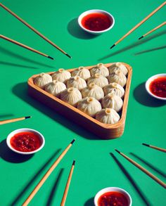 there are many small dumplings on the green table