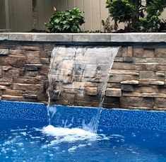 a pool with a waterfall coming out of it