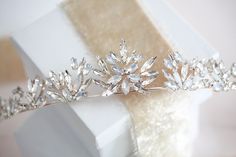 Steal the spotlight with our white opal crown. Elegantly crafted with white opal and clear crystals. It will make you feel like a princess on your wedding day. Surprisingly lightweight! - Created with premium European white opal and clear crystals - Available in rose gold, light gold, and silver. - Tiara measures 14 inches x 1.4 inches - Nickel free and hypoallergenic Browse My Entire Shop For More Jewelry & Accessories: https://www.etsy.com/shop/TheExquisiteBride Browse My Shop For Earrings: ht White Tiara, Rose Gold Crown, Rose Gold Tiara, Silver Tiara, Wedding Hair Wreath, Gold Tiara, Gold Wedding Decorations, Gold Crown, Wedding Tiara