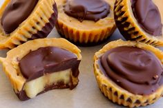 chocolate covered cupcakes sitting on top of a table