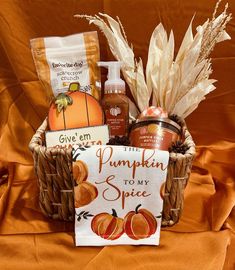 a basket filled with lots of different items on top of a table next to a sign