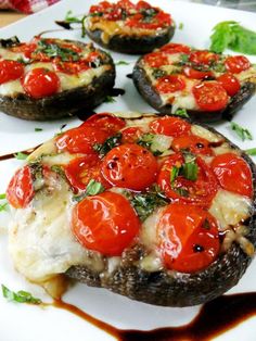 three stuffed mushrooms topped with tomatoes and cheese