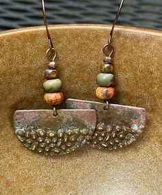 Rustic antique Hammered copper dangle earrings with jasper stones.  Looking for something lightweight, unique and natural? This simple yet elegant pair of hammered copper earrings will definitely make you smile!  These earrings have a very unique hammered texture. The color of the copper changes with the light. They have an antique patina finish for a rustic look. The stones are varieties of jasper.  These earrings are 1 inch in diameter. They are very light weight, less than 3 grams. The French Rust-colored Brass Jewelry With Patina, Patina Brass Rust Jewelry, Earthy Nickel-free Copper Jewelry, Rust-colored Patina Brass Jewelry, Earthy Bronze Jewelry With Ear Wire, Nickel-free Earthy Bronze Jewelry, Earthy Bronze Nickel-free Jewelry, Bohemian Jewelry In Copper Wire With Patina, Handmade Vintage Rust Earrings