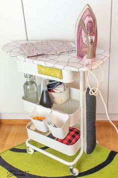 an ironing board with baskets on it and the words how to organize your ironing board