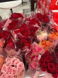 a bunch of roses that are sitting on a table