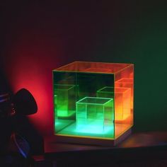 a lit up box sitting on top of a table