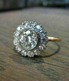 𝐓𝐈𝐓𝐋𝐄  Vintage Style Floral Inspire Ring, Old European Cut Moissanite Diamond Ring, Antique Bezel Set Halo Ring, Woman's Wedding & Engagement Ring. 𝐈𝐓𝐄𝐌 𝐒𝐏𝐄𝐂𝐈𝐅𝐈𝐂𝐀𝐓𝐈𝐎𝐍 : 𝐃𝐈𝐀𝐌𝐎𝐍𝐃 𝐃𝐄𝐓𝐀𝐈𝐋𝐒 : *Diamond Color : White *Diamond Clarity : VVS *Diamond Cut : Excellent *Center Diamond Shape : Old European Cut *Center Diamond Dimension : 9.00 MM *Center Diamond Weight :  2.75 CT *Side Diamond Dimension : 2.30 MM *Side Diamond Weight : 0.65 CT *Total Diamond Weight : 3.40 C Ladies Silver Rings, Vvs Diamond, Flower Engagement Ring, Moissanite Diamond Rings, Deco Vintage, Vintage Victorian, 925 Silver Jewelry, Ring Diamond, Bezel Diamond