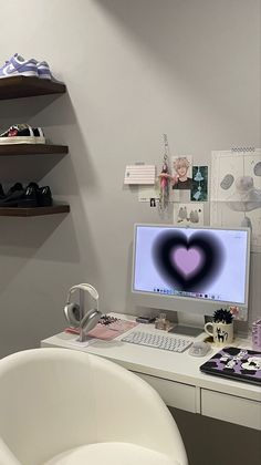 a white desk topped with a computer monitor