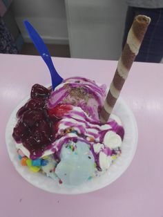 an ice cream sundae on a paper plate