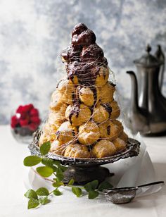 a tower of pastries sitting on top of a table