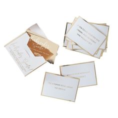 four cards with gold foil on them