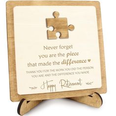 a wooden puzzle frame with the words, never forget you are the piece that made the difference