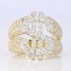 two tone gold and diamond ring with dollar sign on the center, surrounded by smaller diamonds