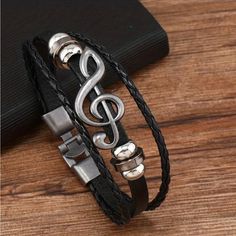 New 3 Band Wrist Bracelet In Black Pu Leather Featuring A Metal G Clif At The Center. Unisex Jewelry With A Cool Music Theme Perfect To Give As A Gift For A Musical Friend. Navy Bracelet, Amazon Cart, Cool Music, Wrist Bracelet, Vintage Charm Bracelet, Music Jewelry, Tiger Eye Bracelet, Treble Clef, Musical Note