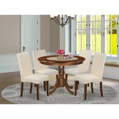 a dining room table with four chairs around it