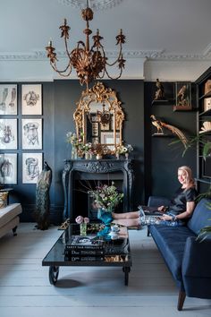 a living room filled with furniture and a chandelier