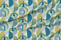 an image of a colorful fabric with peacocks and circles in blue, green, yellow and white