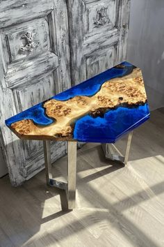 a wooden table with blue paint on it