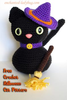 a crocheted black cat with a witches hat and broom