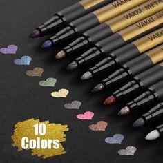 six heart shaped pencils lined up on a black surface with hearts drawn on them