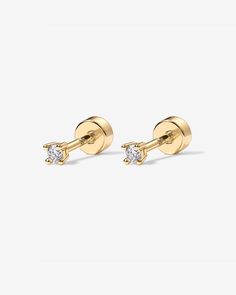 Look gorgeous even when sleeping with our new Must-have Screw Back earrings. These Cubic Zirconia Screw Back Studs are breathtakingly worn solo or as part of an earring stack. Materials: 14K yellow, rose or white gold plated. Measurements: Studs of 2mm, 3mm, and 4mm. These small stud earrings are Crafted with a S925 post that screws into our flat back disc. Classic Gold Cartilage Earrings With Prong Setting, Diamond Earrings With Screw Back, Luxury Diamond Screw Back Earrings, Luxury Gold Screw Back Earrings, Gold Sterling Silver Earrings With Screw Back, Dainty Yellow Gold Earrings With Screw Back, Small Earrings Studs, Screw Back Earrings, Everyday Jewelry