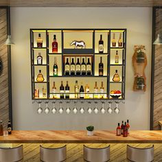 a bar with several bottles and glasses on the shelves, along with four stools