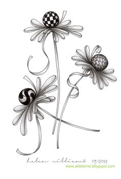 two flowers with black and white designs on the petals, one has a ball in it's center