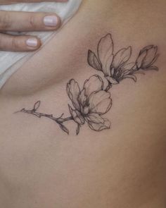 a woman's stomach with flowers on it