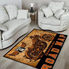 a living room with two couches and a rug on the floor that says harley davidson