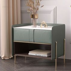 a modern sideboard with gold accents and flowers in a vase on the top shelf