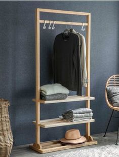 a clothes rack in a room with blue walls