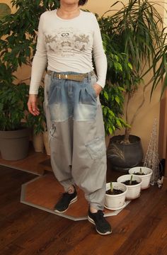 Wide Linen Denim Pants plus size harem pants  pants custom made wide leg pants handmade COMFORT.  Very comfortable harem pants. Unique shalwars in combination of linen with jeans. Great for travel, yoga, daytime walks and evening parties, everywhere you want to feel comfortable and chic. Generously slouchy. Relaxed fit, drop crotch. Draped silhouette. This model is wearing size XL / 165 cm I hope you will enjoy taking a look at my other work. The list will be growing in the coming days, so stay tuned : S     US S 4-6,     UK 10-12,   It 40-42. Fr 36-38 M    US S 8-10,    UK 14-16,  It 44-46, Fr 40-42 L     US S 12-14,   UK 18-20,  It 48-50, Fr 44-46 XL   US S 16-18,  UK 20-22,  It 50-52,Fr 46-48 XXL US S 20-22, UK 24-26, It 52-54, Fr 48-50 3XL US S 24-26, UK 28-30, It 54-56, Fr 50-52 If yo Plus Size Harem Pants, Pants Unique, Pants Custom, Pants Denim, Loose Trousers, Large Sweaters, Wide Leg Linen Pants, Knitted Poncho, Pantalon Large