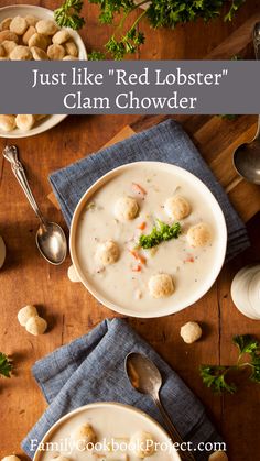 two bowls of red lobster clam chowder on a wooden table