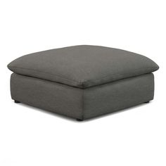 a grey ottoman that is sitting on the ground