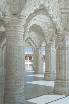 an ornate white building with columns and arches