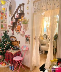 a cat is laying on the floor in front of a christmas tree and other decorations